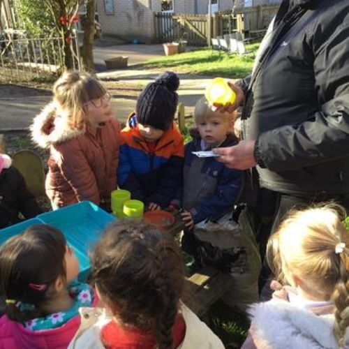 Learning how to grow and take of plants - planting sunflowers.